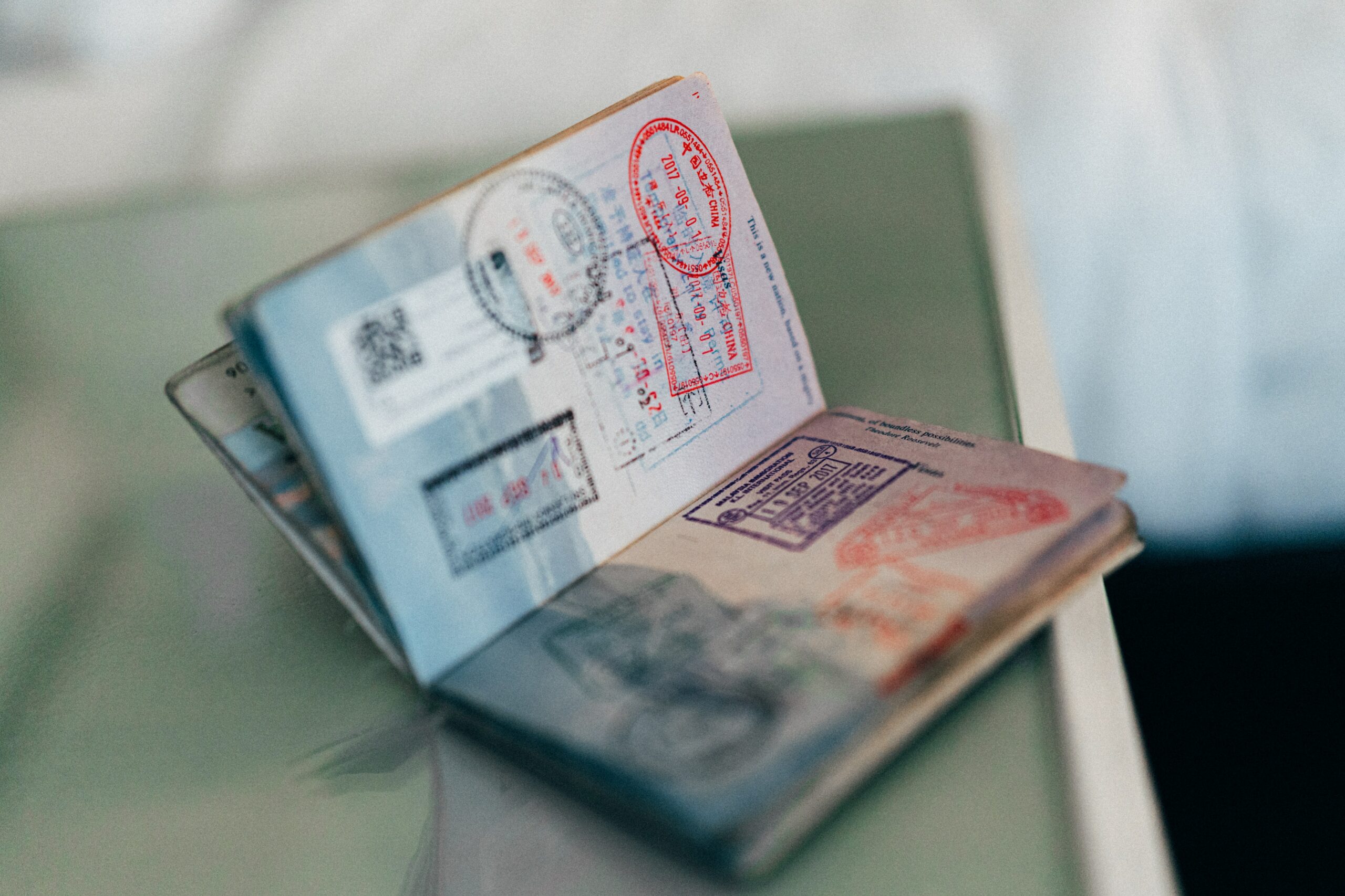 Passport with stamps open on a table