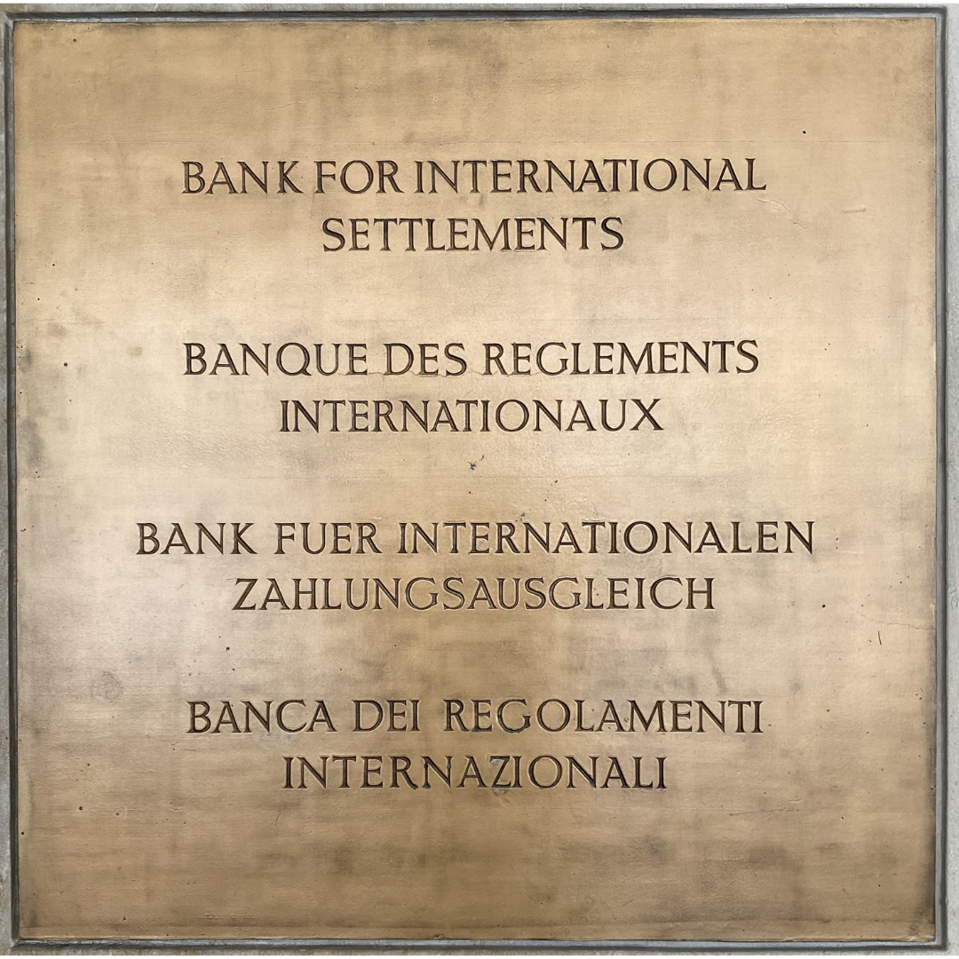 Bronze coloured plaque with the text Bank for International Settlements in English, French, German and in Italian.