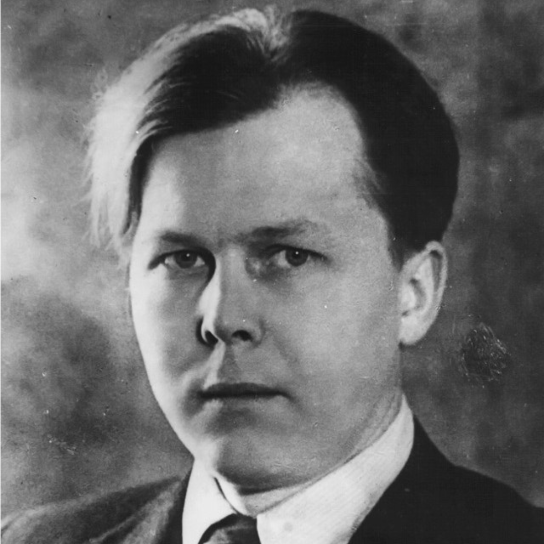Black-and-white studio portrait of Soviet poet Aleksandr Tvardovsky as a young man, wearing a dark suit and tie.